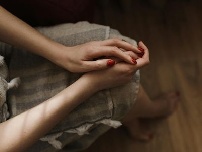 Close-up of a person's hands in a relaxed position.